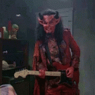 Satan playing the guitar