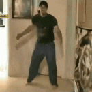Guy kicks cat while playing Kinect
