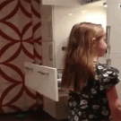 Dad uses vacuum to make daughter a pony tail