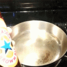Pouring beer in a hot frying pan