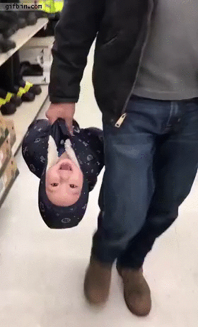 carrying-baby-in-the-store.gif