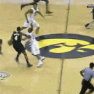 Basketball player tripped by teammate, makes assist