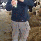 Man drinks beer out of his rubber boot