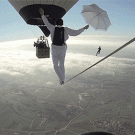 Daredevil tightrope walk between two hot-air balloons