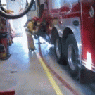 Fireman swept by hose