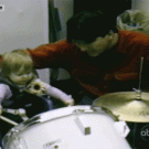 Kid hits dad with drum stick... twice