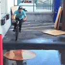 BMX slide over puddle trick