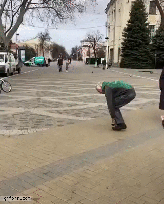 Old man rides tiny bike