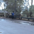 Waving dog walker gets splashed by cars