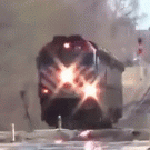 Woman crosses train tracks