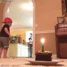 Kid blows out candle with ball