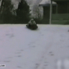 Kid on sled hits snowman