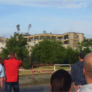 Guy looking at demolition almost hit by flying rock