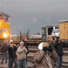 Oblivious train watcher nearly hit from behind
