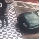 Girl tries to sit on car