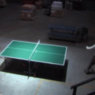 Two guys playing ping-pong