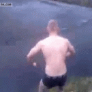 Drunk guy jumps in frozen lake