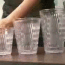 Pouring drinks into glasses illusion