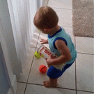 Kid gathering tennis balls