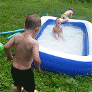 Kid jumps in kiddie pool