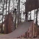 Riding BMX ramps in the woods