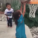 Kid helps girl play basketball