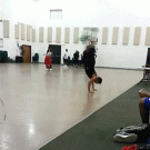 Guy doing backflips almost hits basketball player