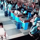 Man at supermarket saves beer at dropping it